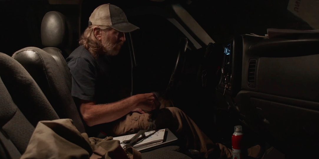 Cal pulling an SD card in the truck